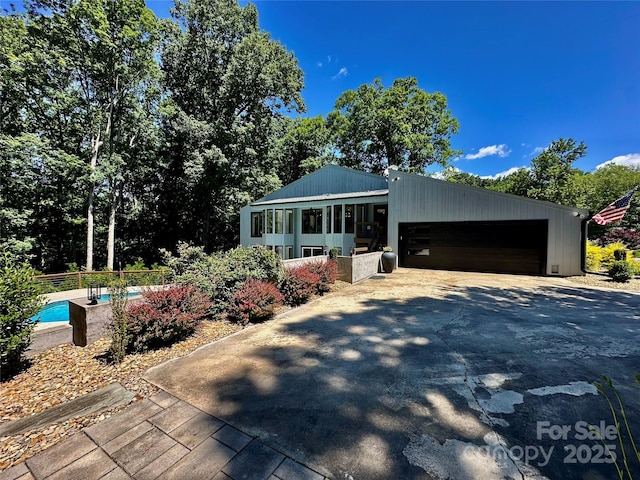 18 Pickett Ave, Spencer, NC 28159 - view of front of property featuring driveway and a garage