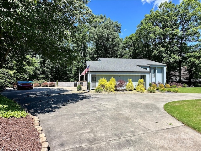 18 Pickett Ave, Spencer, NC 28159 - view of property exterior with driveway and roof with shingles