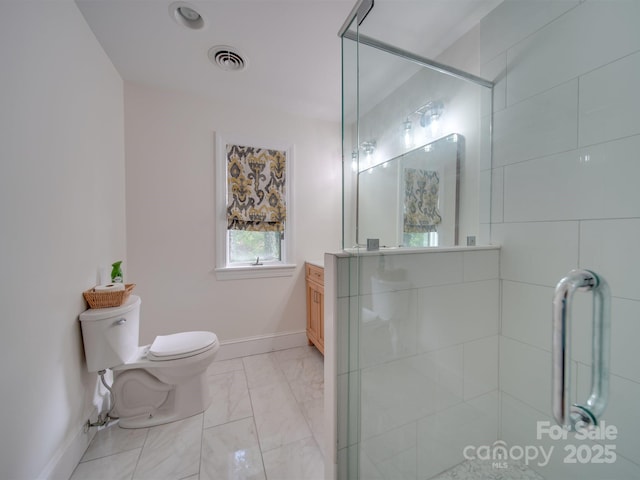 18 Pickett Ave, Spencer, NC 28159 - bathroom with toilet, tiled shower, vanity, marble look tiles, and baseboards