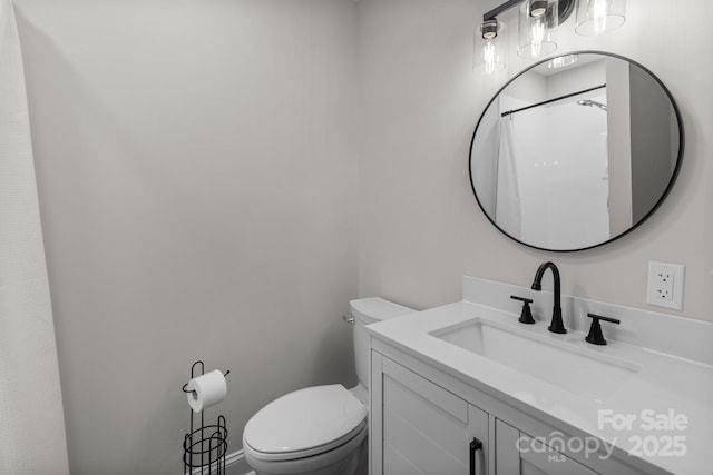 full bathroom featuring toilet and vanity