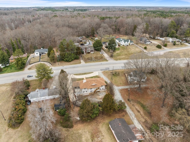 aerial view featuring a view of trees