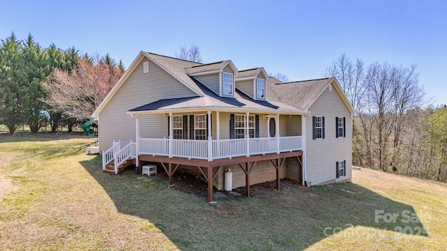 view of front of house with a porch and a front yard