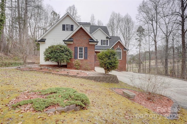 5306 Club View Dr, Concord, NC 28025 - traditional-style house with brick siding, concrete driveway, and a shingled roof