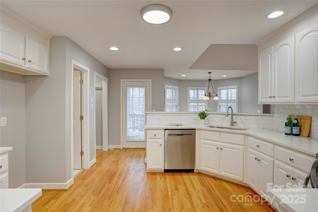 5306 Club View Dr, Concord, NC 28025 - kitchen featuring dishwasher, a sink, baseboards, backsplash, and a peninsula