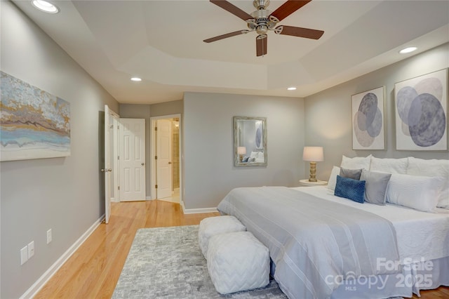 5306 Club View Dr, Concord, NC 28025 - bedroom featuring a raised ceiling, light wood finished floors, recessed lighting, baseboards, and ceiling fan