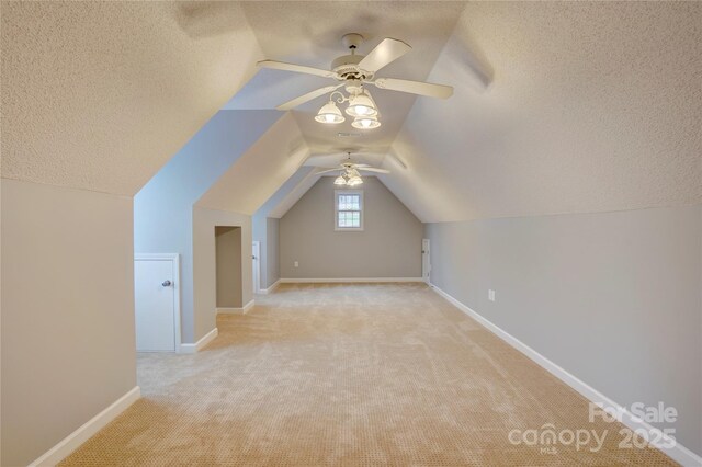 5306 Club View Dr, Concord, NC 28025 - bonus room featuring a textured ceiling, light colored carpet, a ceiling fan, and lofted ceiling