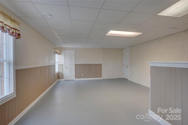 5306 Club View Dr, Concord, NC 28025 - spare room with concrete floors, a drop ceiling, wainscoting, and wood walls