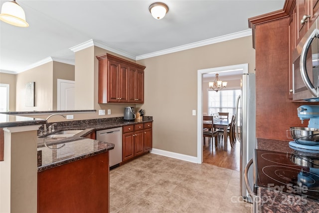 kitchen with a sink, stainless steel appliances, an inviting chandelier, and ornamental molding