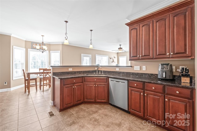 kitchen with a sink, plenty of natural light, stainless steel dishwasher, a peninsula, and crown molding