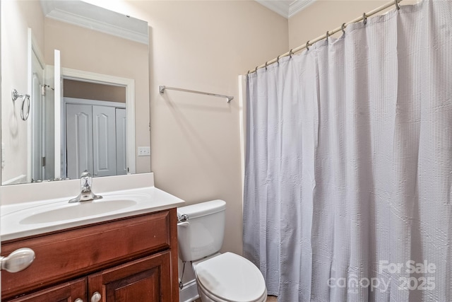 bathroom featuring vanity, crown molding, toilet, and a shower with curtain