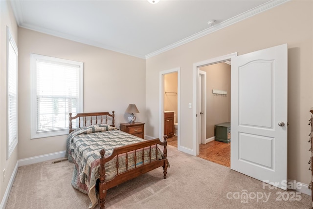 bedroom with light colored carpet, baseboards, and ornamental molding