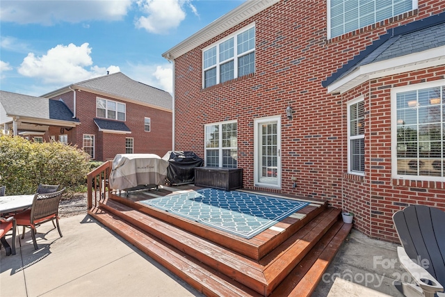 wooden deck featuring outdoor dining area and area for grilling