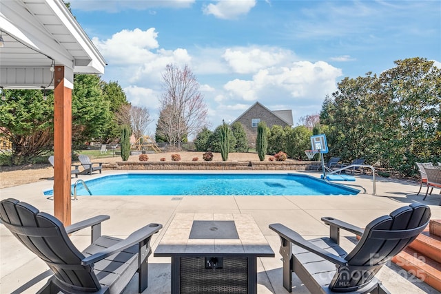 outdoor pool featuring a patio and fence