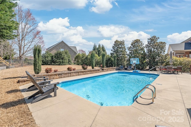 view of pool featuring fence, a patio area, and a fenced in pool