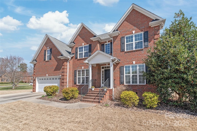 view of front of home featuring brick siding, an attached garage, and driveway