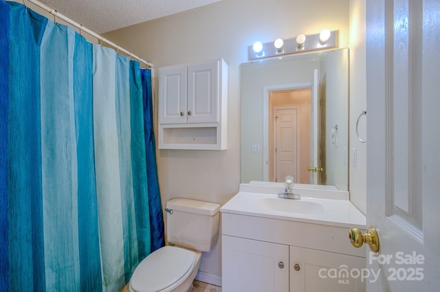 bathroom with a shower with shower curtain, toilet, a textured ceiling, and vanity