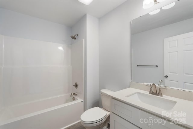 bathroom featuring vanity, toilet, and washtub / shower combination