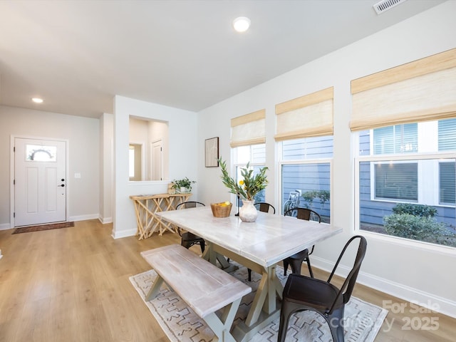 dining area featuring recessed lighting, light wood-type flooring, baseboards, and visible vents