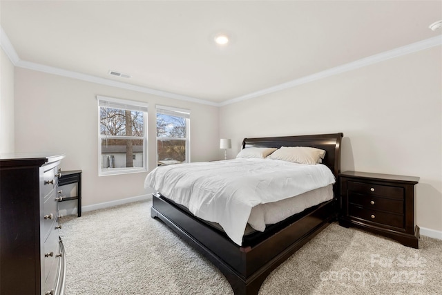 bedroom with visible vents, light colored carpet, baseboards, and ornamental molding