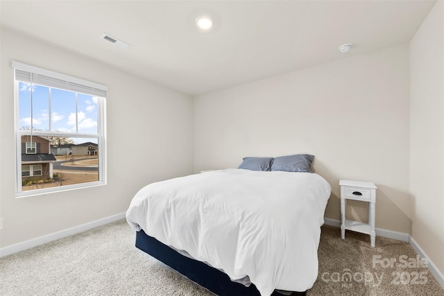 bedroom featuring carpet flooring, baseboards, and visible vents