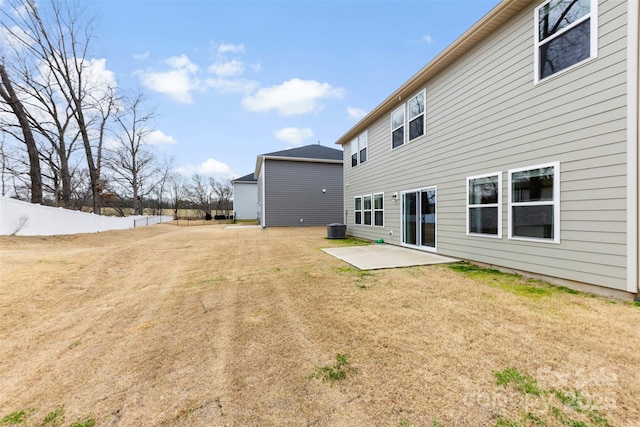 rear view of house featuring a patio area, cooling unit, a yard, and fence