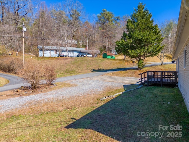 view of yard with a wooden deck