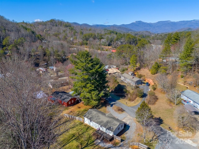 bird's eye view with a wooded view and a mountain view