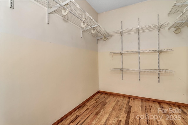 spacious closet with light wood-style floors