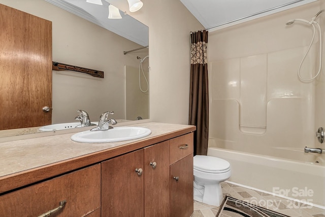 full bath featuring vanity, toilet, and shower / bath combo