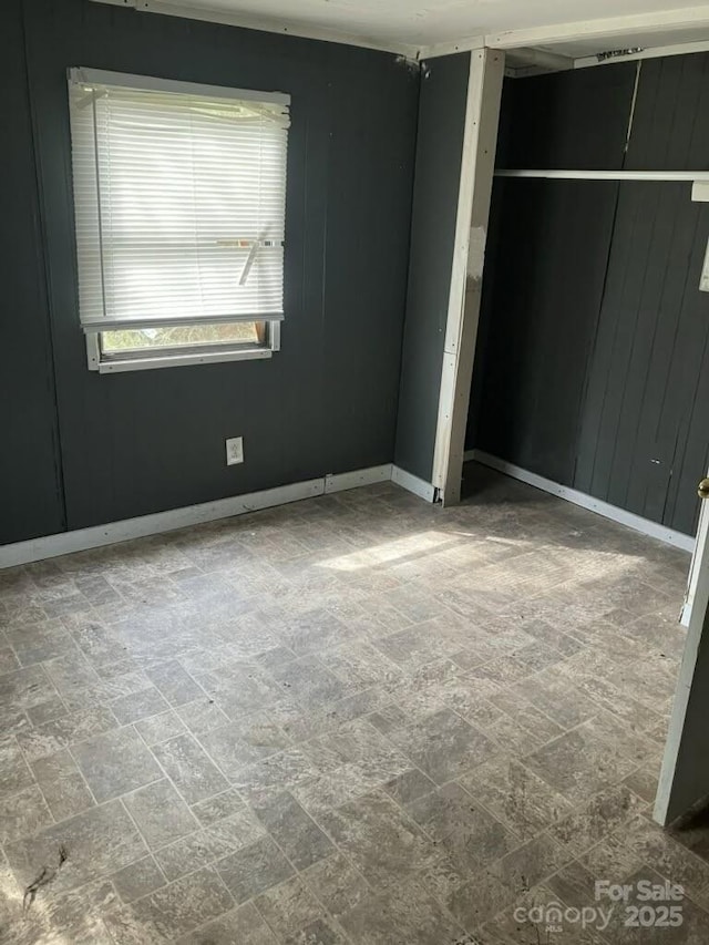 unfurnished bedroom featuring baseboards