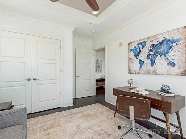 home office with ceiling fan, baseboards, dark wood-style flooring, and ornamental molding