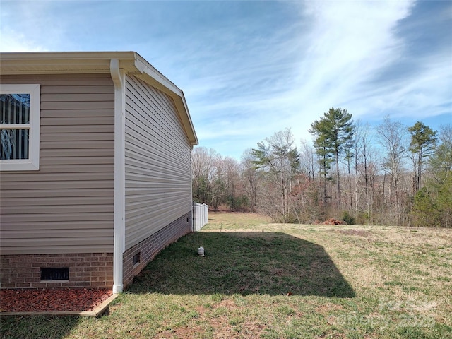 exterior space featuring crawl space and a yard