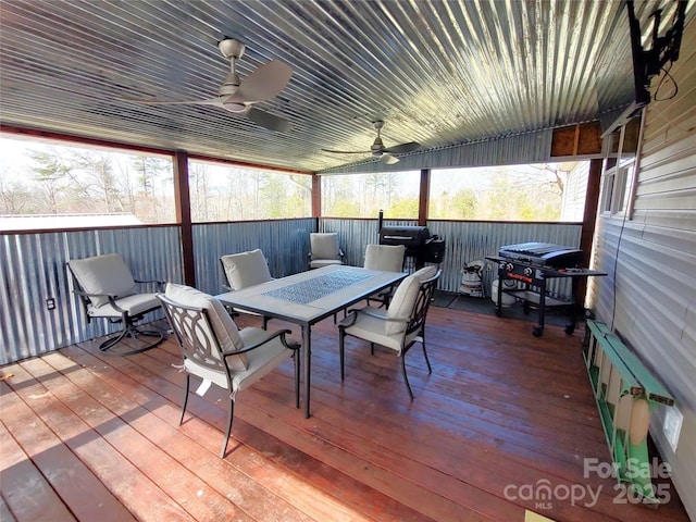 deck with area for grilling, outdoor dining area, and ceiling fan