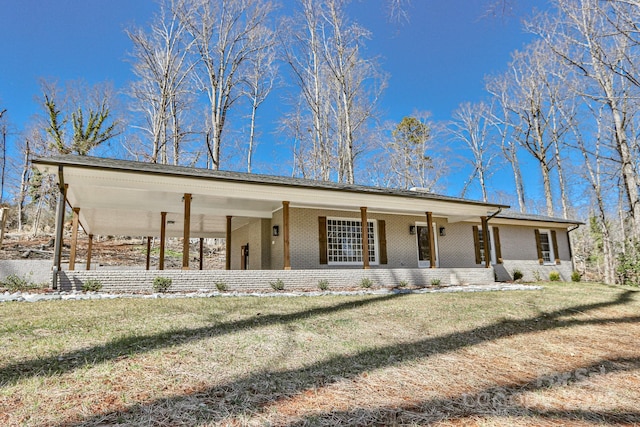 view of front facade featuring a front lawn, covered porch, and brick siding