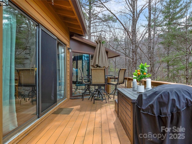 wooden deck featuring grilling area