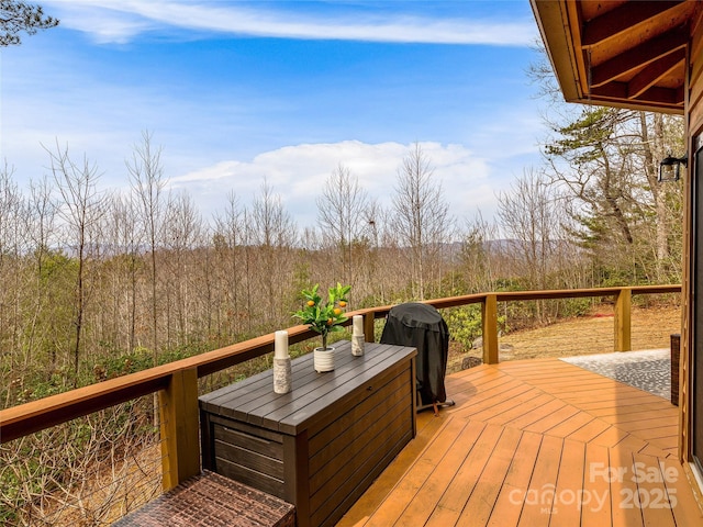 wooden deck featuring grilling area