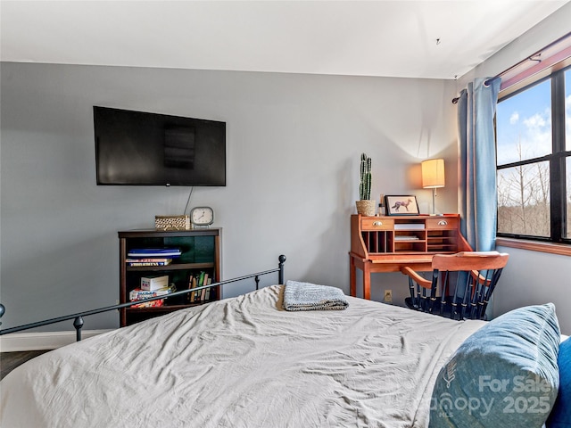 bedroom featuring baseboards