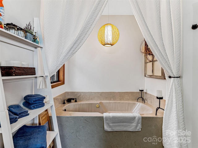 bathroom with a garden tub