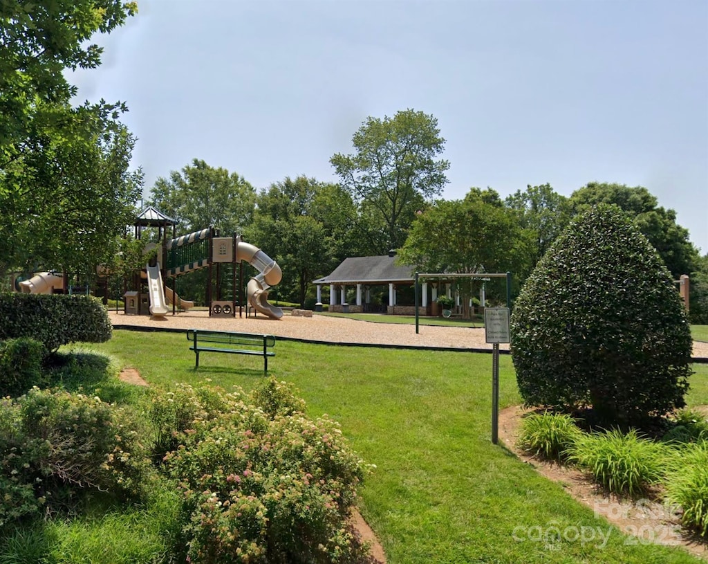 community play area featuring a lawn