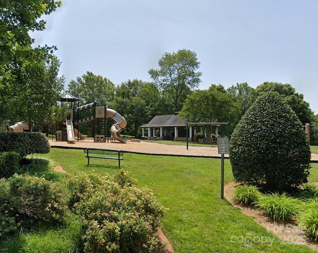 community play area featuring a lawn