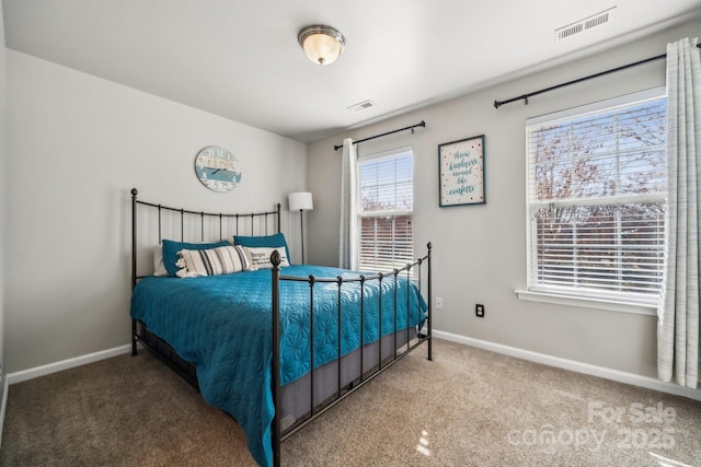 bedroom featuring carpet, visible vents, and baseboards