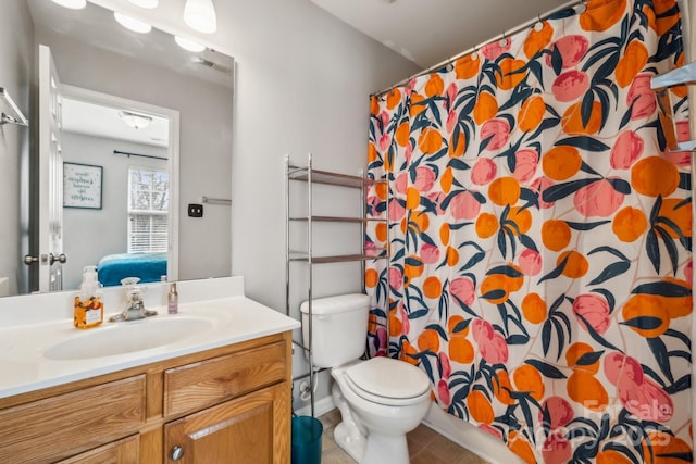 bathroom featuring visible vents, connected bathroom, toilet, tile patterned floors, and vanity