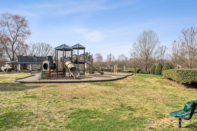 communal playground featuring a lawn