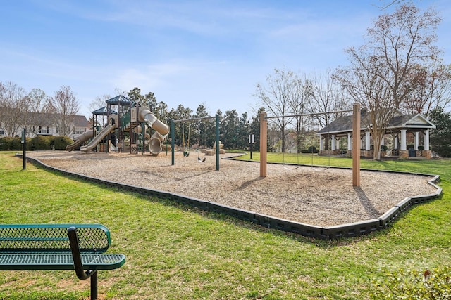 community playground featuring a lawn