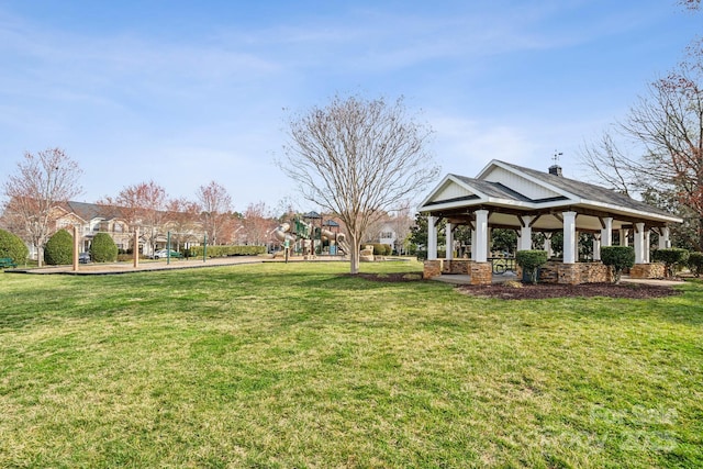 view of home's community with a gazebo, playground community, and a lawn