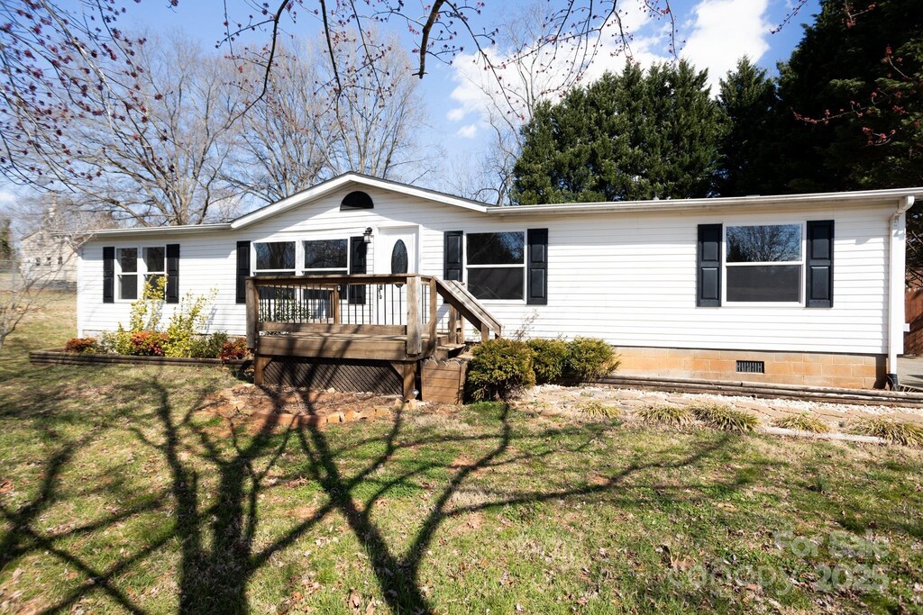 111 Hollar St, Morganton, NC 28655 - view of front of house with a deck and a front yard
