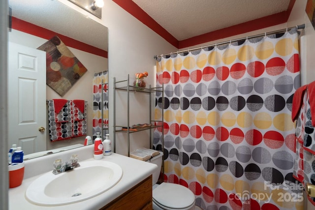 bathroom featuring a shower with shower curtain, a textured ceiling, vanity, and toilet