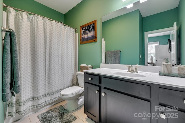 bathroom with tile patterned flooring, toilet, vanity, and a shower with curtain