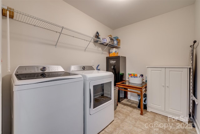 laundry area with laundry area and washer and clothes dryer