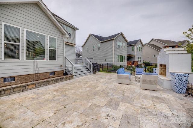 view of patio featuring an outdoor hangout area and fence